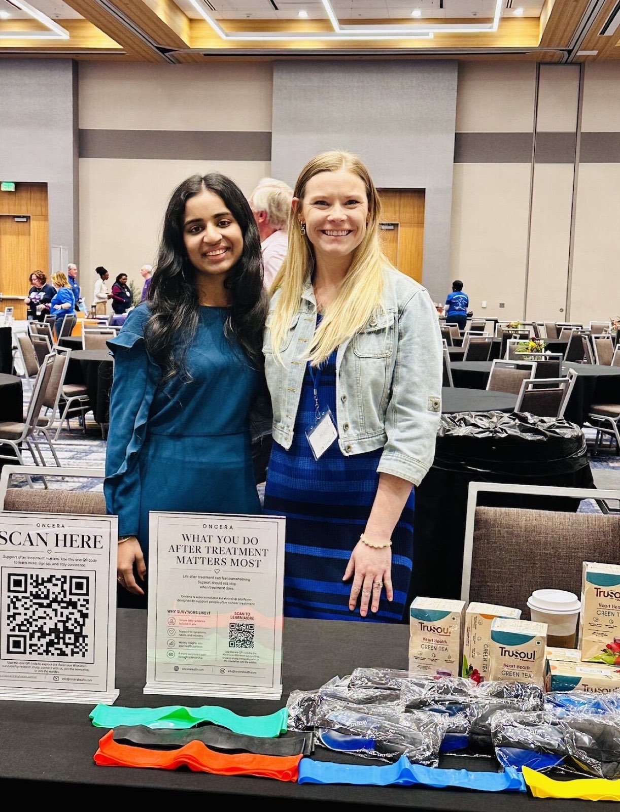 The Oncera team at their resource table in the Survivorship Village