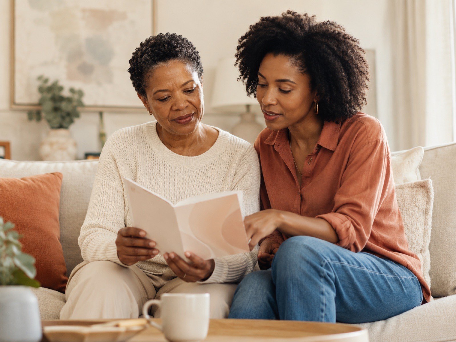 A cancer survivor reviewing survivorship guidance with a loved one